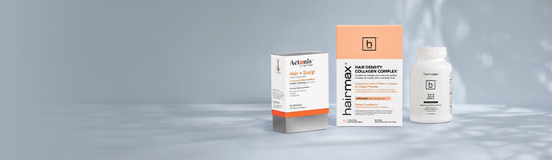 Actonis Hair + Scalp supplements, Hairmax Collagen complex sachets and hairmax supplements on a gray blue table